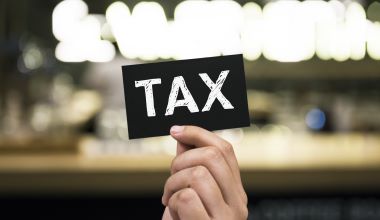 Closeup of hand holding black paper card