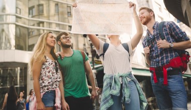 Tourist group led by tour guide on their travel